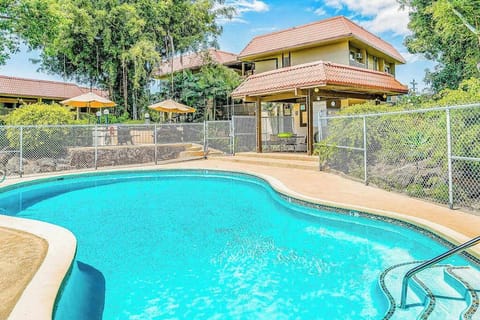 Large Curved Swimming Pool, Safety Fence, Pool Deck & Building Views