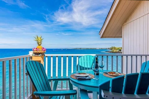 Private Ocean-Facing Balcony Dining Setup with Panoramic Sea Views