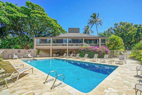Refreshing swimming pool surrounded by tropical landscaping