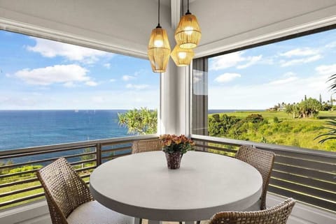 Oceanview lanai dining area overlooking the coastline
