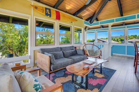 Living room with panoramic views comfortable seating and a flat screen tv.
