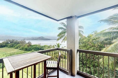 Covered balcony provides dining space, mountain views, and refreshing breezes