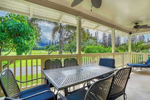 Covered porch with outdoor dining table, perfect for morning coffee