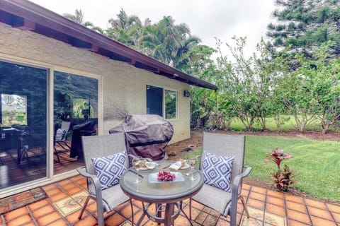 Covered Outdoor Lanai with Seating & Garden Views