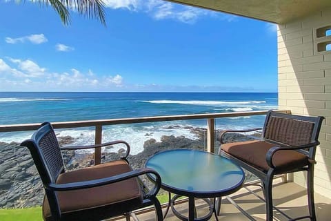 Private lanai with views of the waves of the Pacific Ocean crashing on to the shore.