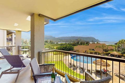 Relax on the balcony while enjoying sweeping mountain and island views