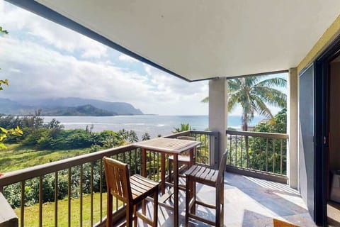Covered balcony offers dining seating, mountain vistas, and tropical breezes