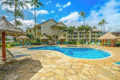  Inviting pool area with lounge chairs and beautiful island views.