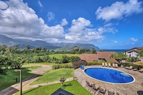 Sweeping resort views showcase lush greenery mountains and sparkling waters