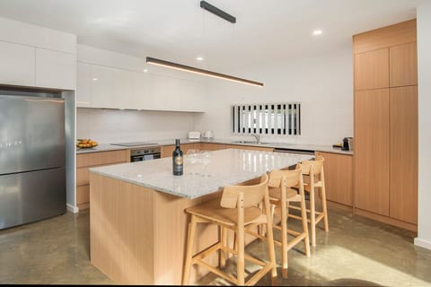 Modern light-filled kitchen with large island and seating for four