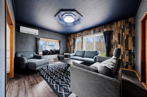 Apartment | Living area | 55-inch flat-screen TV with digital channels