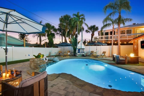 As the sun sets, this private backyard oasis transforms into the ultimate twilight retreat