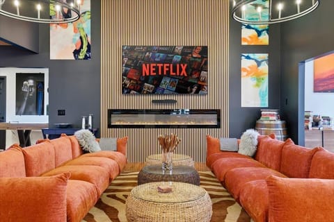  Claim your corner of the sofa, light the fireplace, and let the group settle in — this is the living room everyone drifts back to.