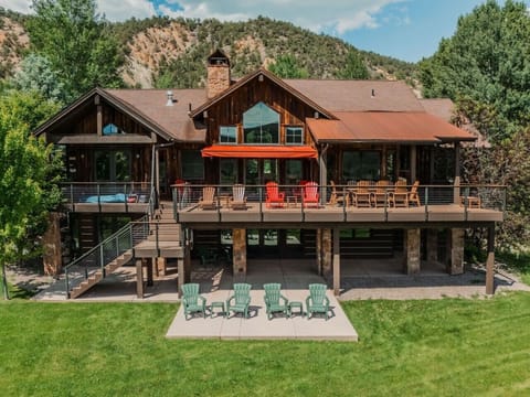 Expansive lodge exterior and mountain backdrop