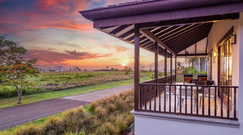 A covered terrace overlooking open lush landscape, where the Pacific sunset puts on a show every evening. Dining, unwinding, or simply watching the sky.