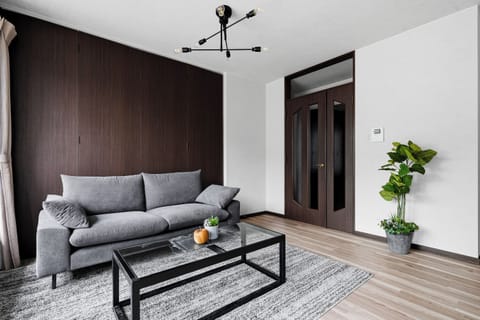 Apartment | Living area | 50-inch flat-screen TV with digital channels