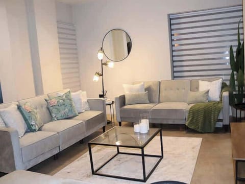 Enjoy the benefits of a spacious open-plan design featuring a lounge area, dining space, and kitchen all in one. Whether you're preparing meals, sharing dinner, or watching TV, the room provides a comfortable setting for every occasion.