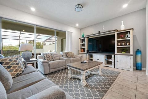 Designed for comfort and connection. Featuring plush seating, an open-concept layout, and plenty of natural light, it's the perfect place to gather with family and friends after a day of exploring Orlando's world-famous attractions.