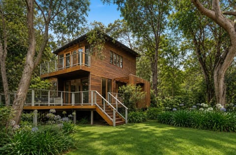 Secluded timber retreat with wraparound deck and tranquil bush views