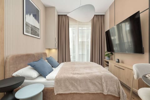 Relax in the stylish living room with a comfortable sofa and modern decor.