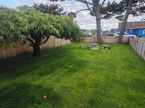 Peaceful Front Lawn – A lush, open space to relax and enjoy the fresh coastal air.