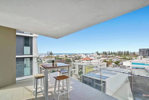 Take your meals outdoors on the private balcony, where bar-height seating and glimpses of the ocean invite you to savour the coastal outlook.