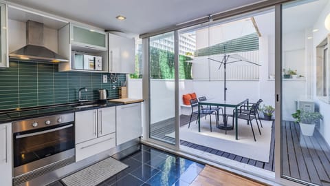 Cook with ease, then step straight onto your private patio for al fresco dining and relaxing moments in the Lisbon sunshine. #PrivatePatio #ModernKitchen #OutdoorDining #CityStay #Portugal #PT #Lisbon