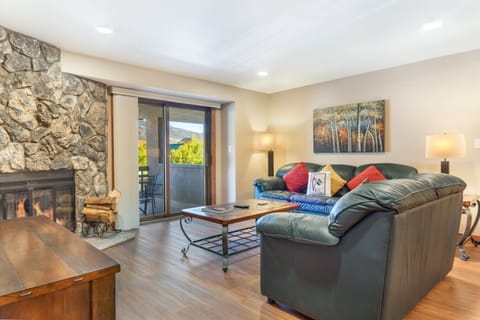 Living room with fireplace and sliding door to balcony