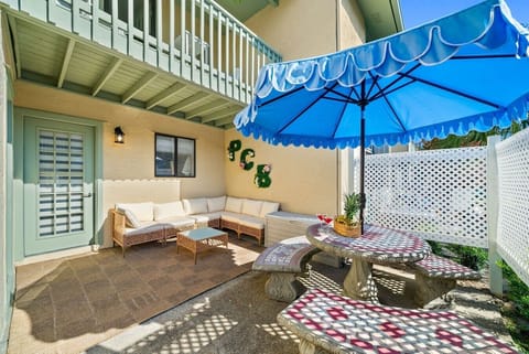 Patio | Sectional Seating Area | Mosaic Dining Table & Blue Market Umbrella