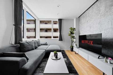 Apartment | Living area | 50-inch flat-screen TV with digital channels