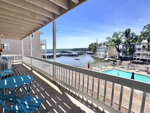 Patio area over looking community pool and lake