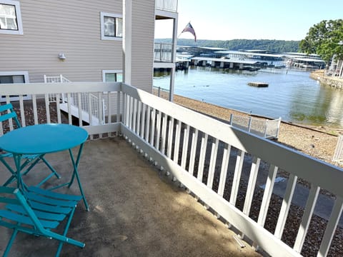 Patio space right outside front door overlooking pool and lake. 