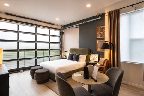 Deluxe studio with beautiful floor to ceiling glass garage opening door!