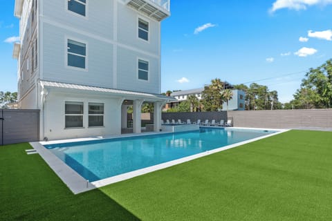 Private pool and raised spa with a covered terrace just steps from the water.