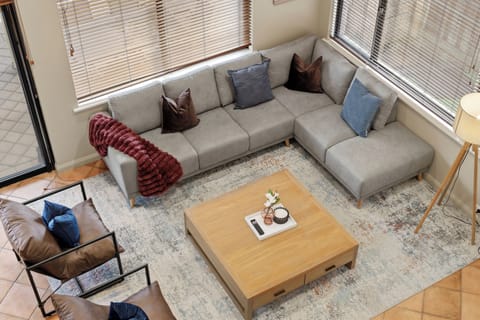 Take a load off in our cozy lounge area, featuring a large sectional and warm, modern décor.