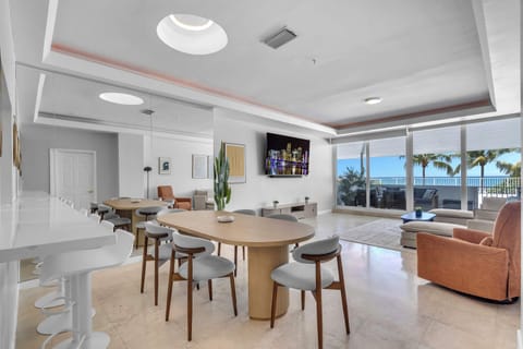 Dine with a view, relax in style, or work remotely in this breezy coastal-themed space with ocean backdrop.