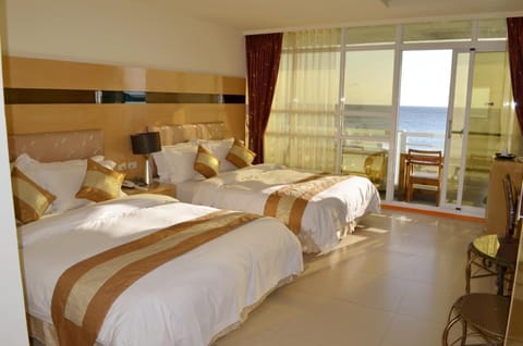 Quadruple Room, Sea View | Blackout drapes, free WiFi