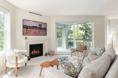 Living Room - Gas fireplace, queen sofa bed, light-filled windows — spacious 2-bedroom living at its best