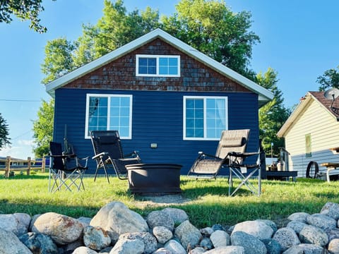 Seating around the fire on the beach includes 4 loungers, and 3 chairs!