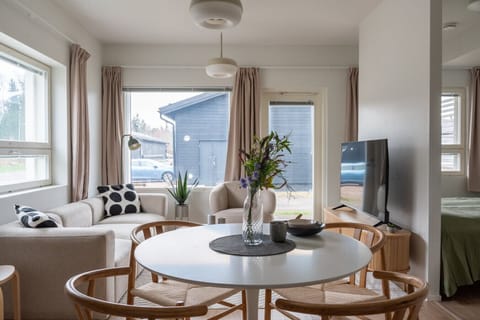 Cosy living room has new smart TV and access to the terrace.