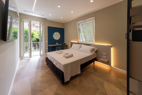 Luxury Apartment, Balcony, City View | Pillowtop beds, in-room safe, blackout drapes, iron/ironing board
