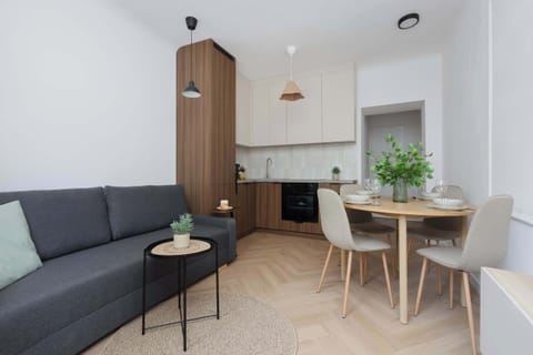 A welcoming living room connected to the dining area and kitchenette. It's an ideal place to spend quality time together after a busy day.