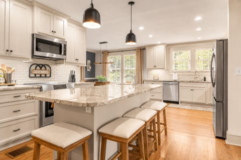 Open-Concept Kitchen with Oversized Island for Cooking and Gathering