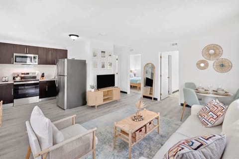 Kick back in the inviting living room, complete with comfortable seating and a Smart TV for relaxing evenings.