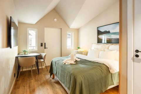 Bright & Airy Bedroom Retreat Unwind in your sunlit sanctuary with a plush queen bed, warm wood floors & stunning wall art — the perfect Bergen basecamp after a day of exploring!