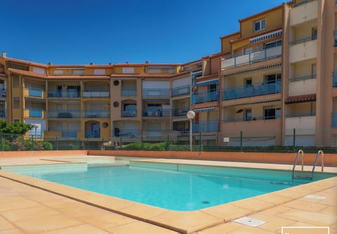 The residence's shared pool is open during the summer