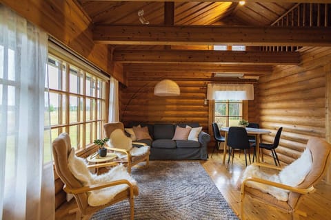 Comfort Cabin, 2 Bedrooms | Living area | 45-inch Smart TV with cable channels, fireplace