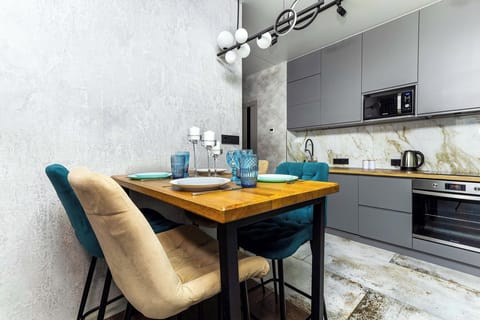 Luxury Apartment, Balcony, City View | Private kitchen | Electric kettle, griddle, cleaning supplies, freezer