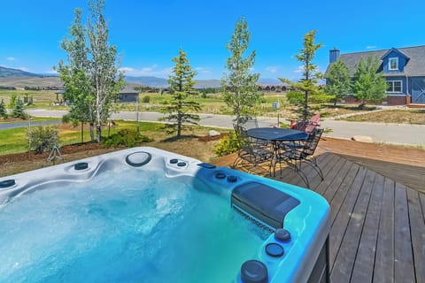 Relax in your Private Hot Tub with panoramic mountain views on Grand Elk Golf Course.