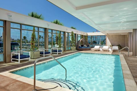 Outdoor pool, open 7:00 AM to 10:00 PM, free cabanas, sun loungers